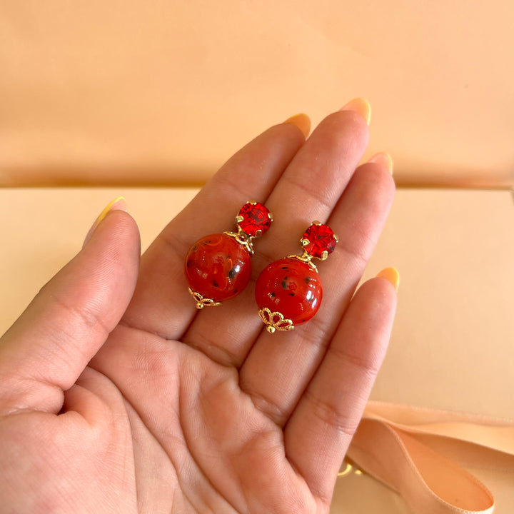 Red preciosa crystals with resin studs
