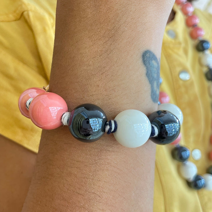 Coral and black ceramic knotted gold plated bracelet