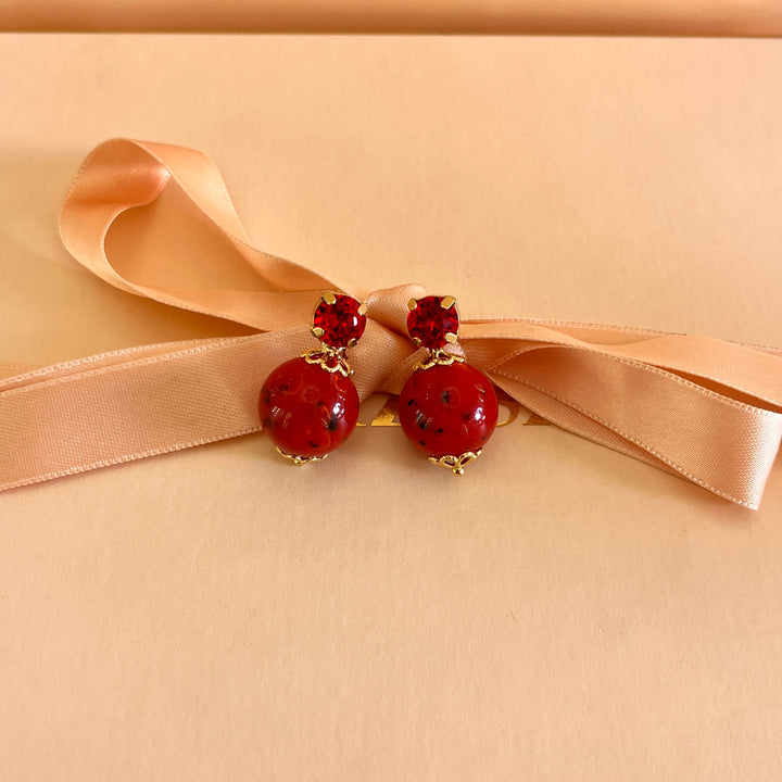 Red preciosa crystals with resin studs