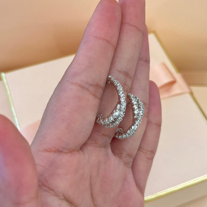 Silver zircone crossed half hoops