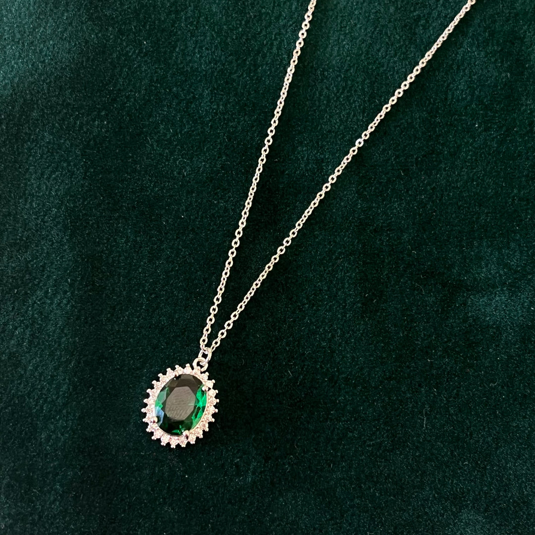 Dark green oval zircone set