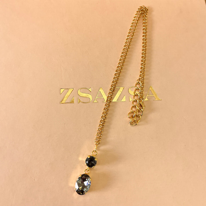 Grey oval and round preciosa crystals set