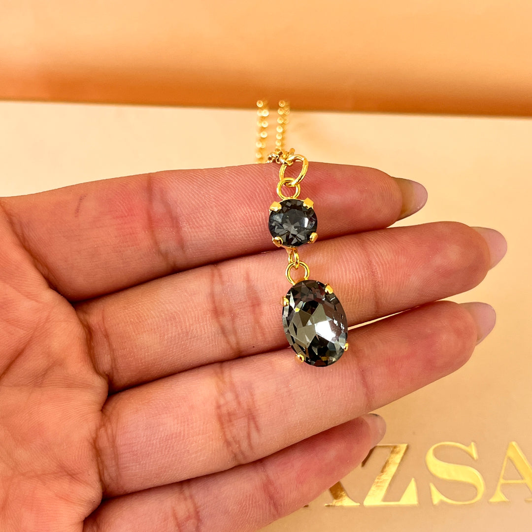 Grey oval and round preciosa crystals set