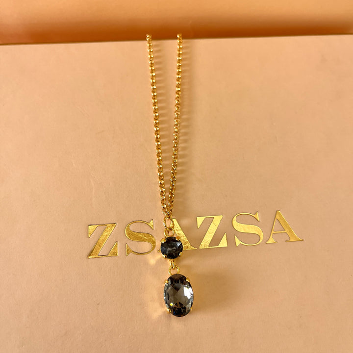 Grey oval and round preciosa crystals set