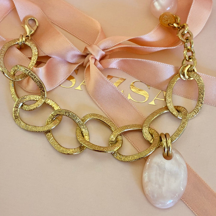 Gold plated light pink bracelet