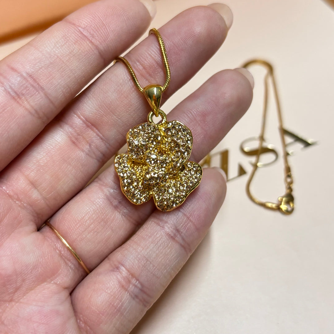 Dainty bronze rhinestone flower pendant