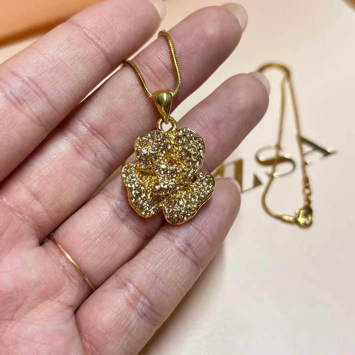 Dainty bronze rhinestone flower pendant