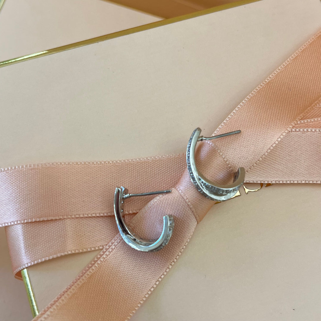 Silver zircone crossed half hoops