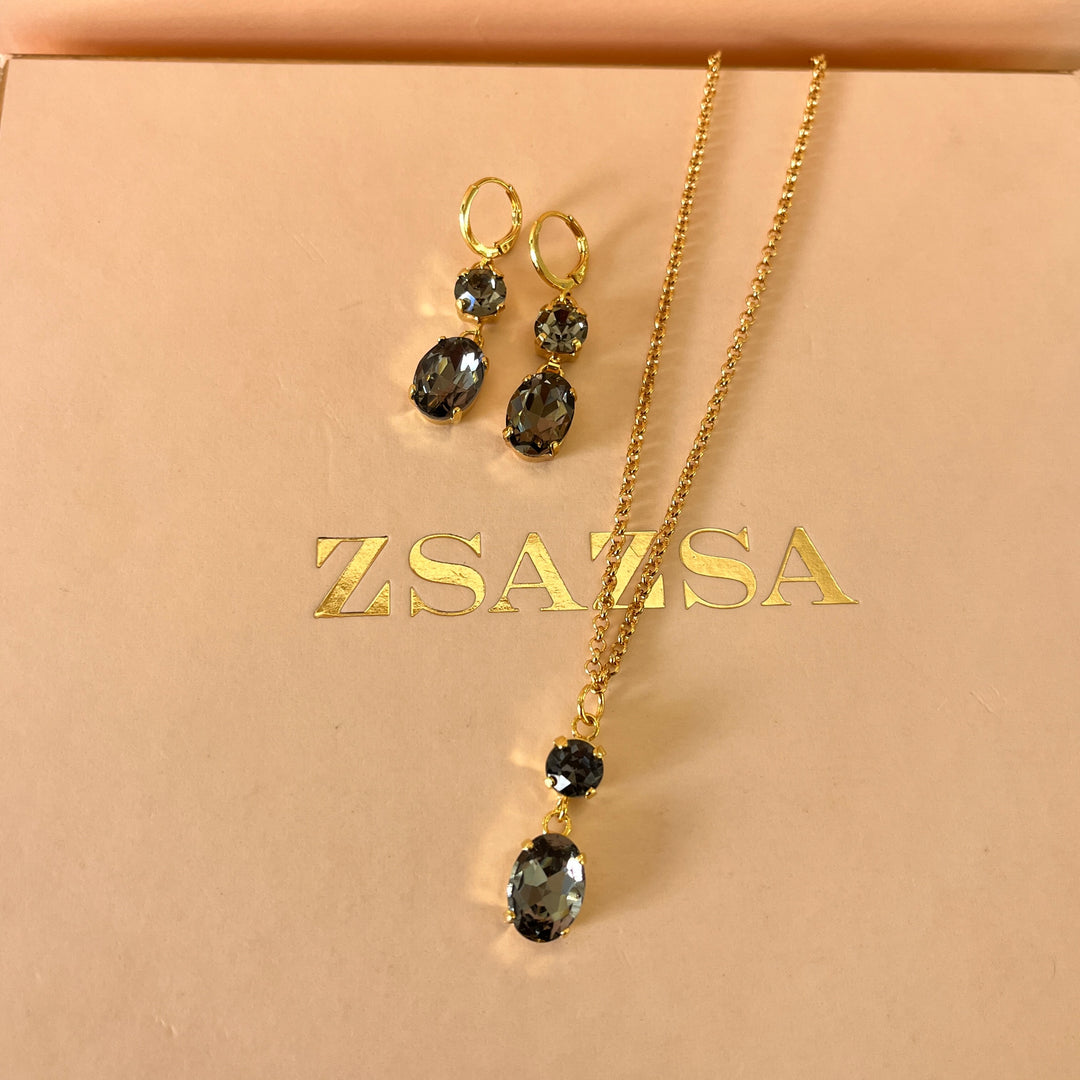 Grey oval and round preciosa crystals set