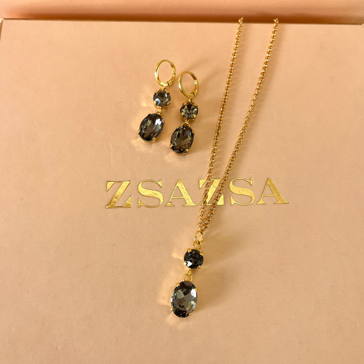 Grey oval and round preciosa crystals set