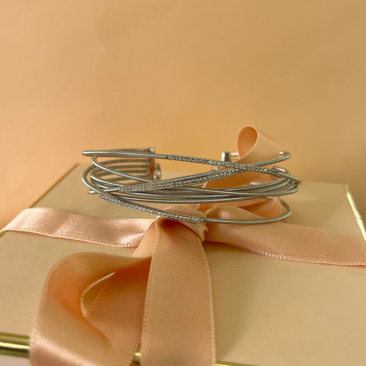 Crossed silver zircone bangle