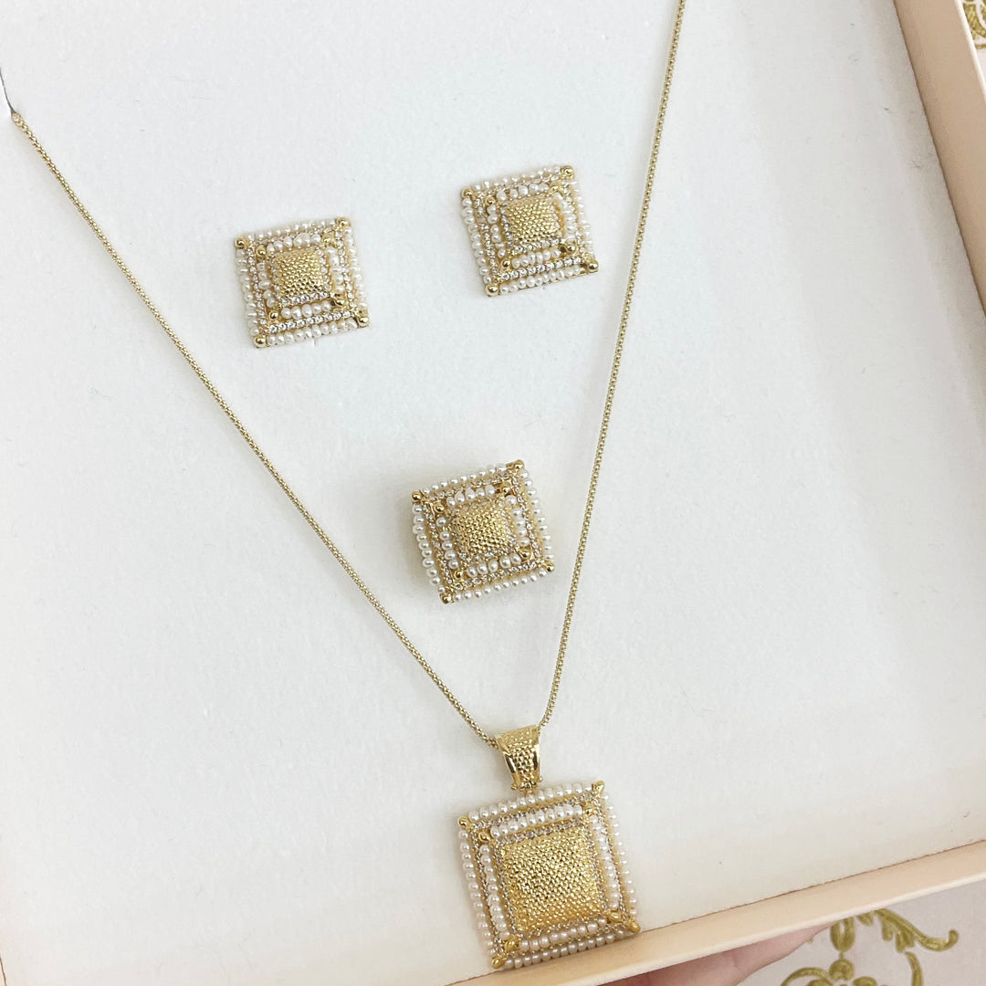 Gold square set with fresh water pearls
