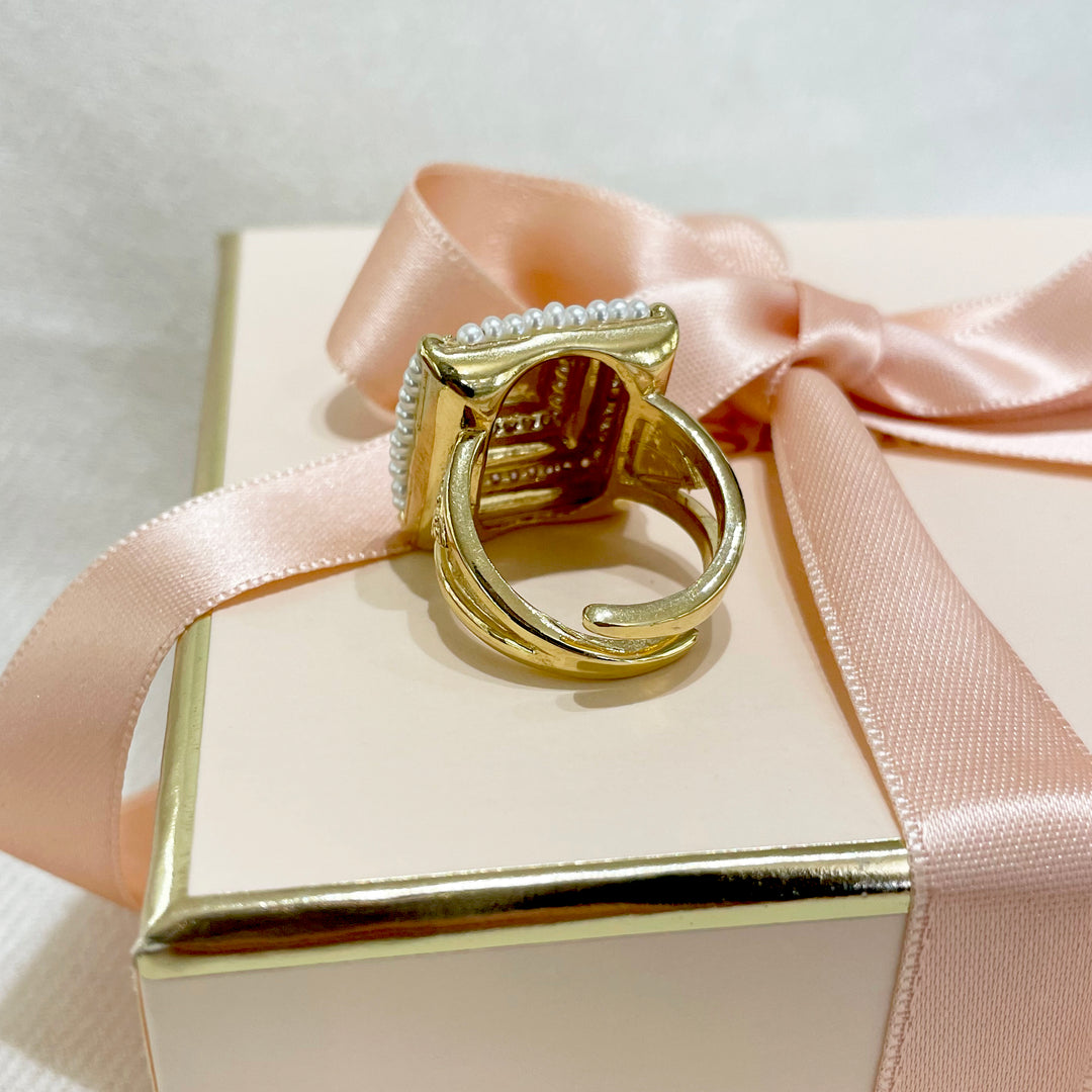 Gold square set with fresh water pearls