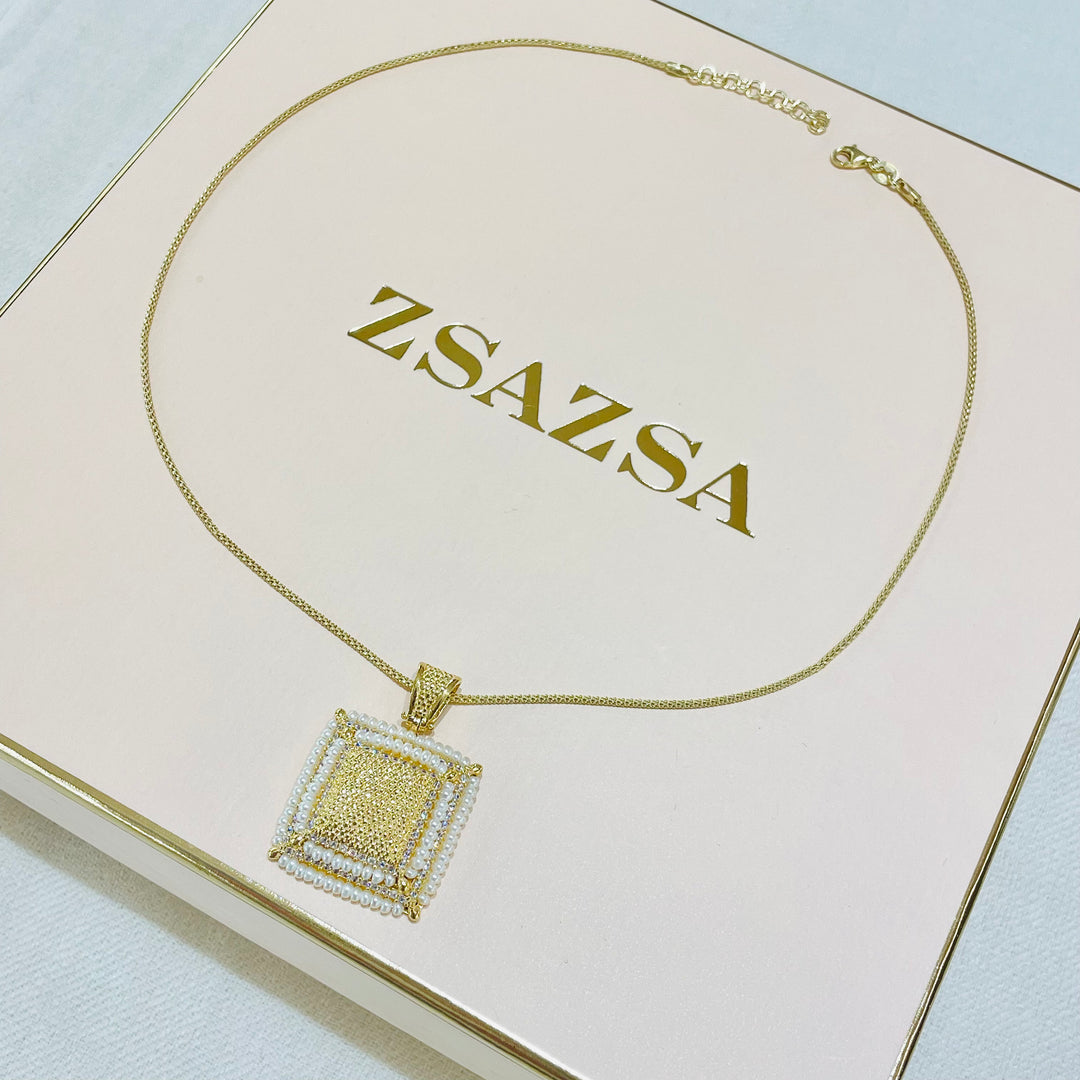 Gold square set with fresh water pearls