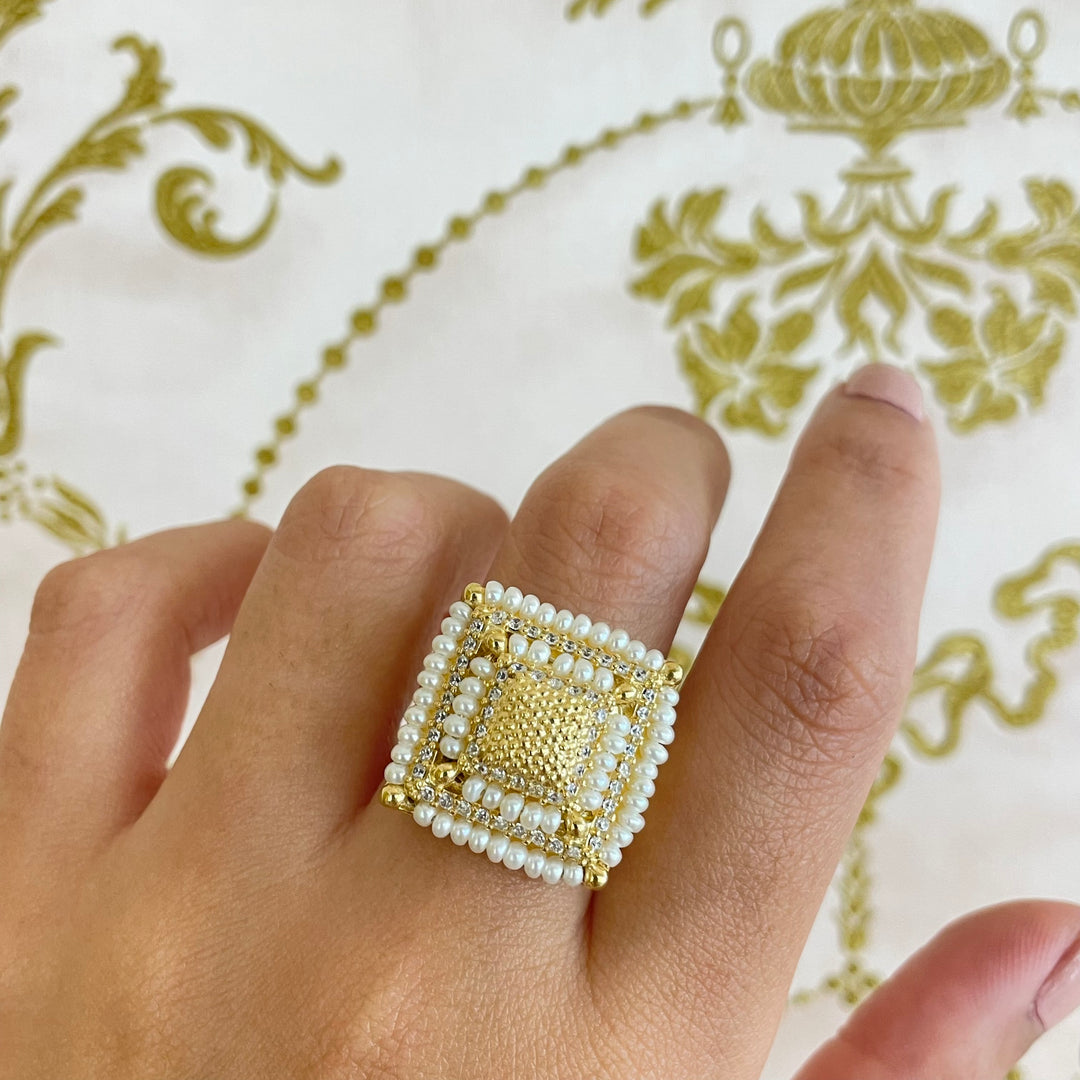 Gold square set with fresh water pearls