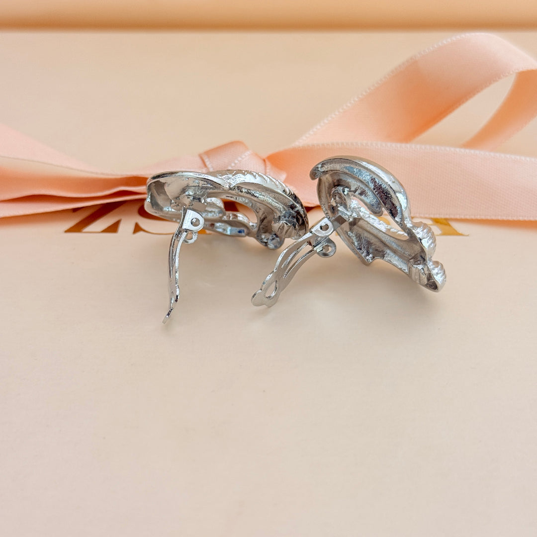 Plain twisted silver clip on earrings