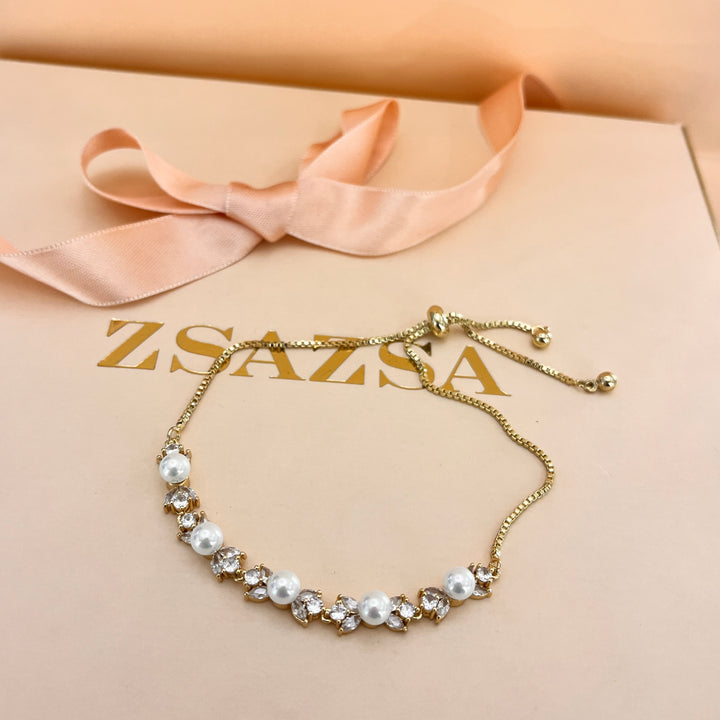 Zircone and white pearls gold plated bracelet