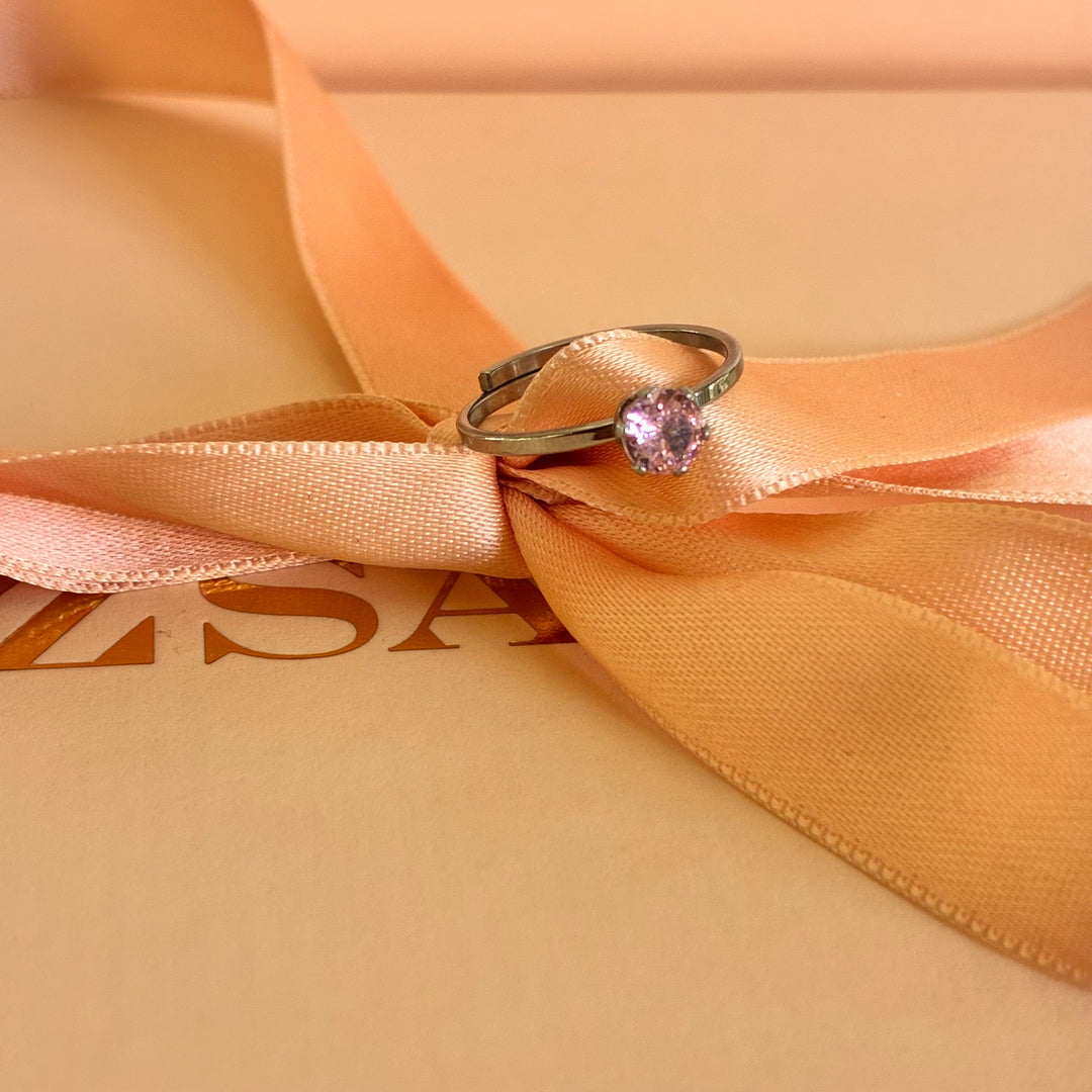 Solitaire light pink stainless steel ring