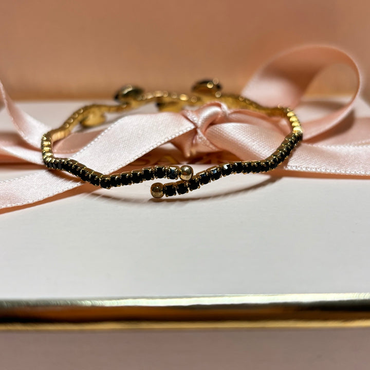 Dainty black gold bangle