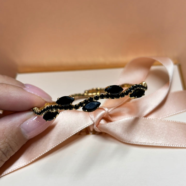 Dainty black gold bangle