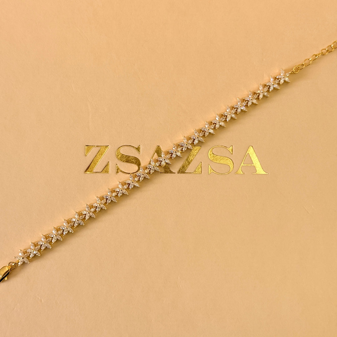 Dainty flowers zircone gold plated earrings and bracelet