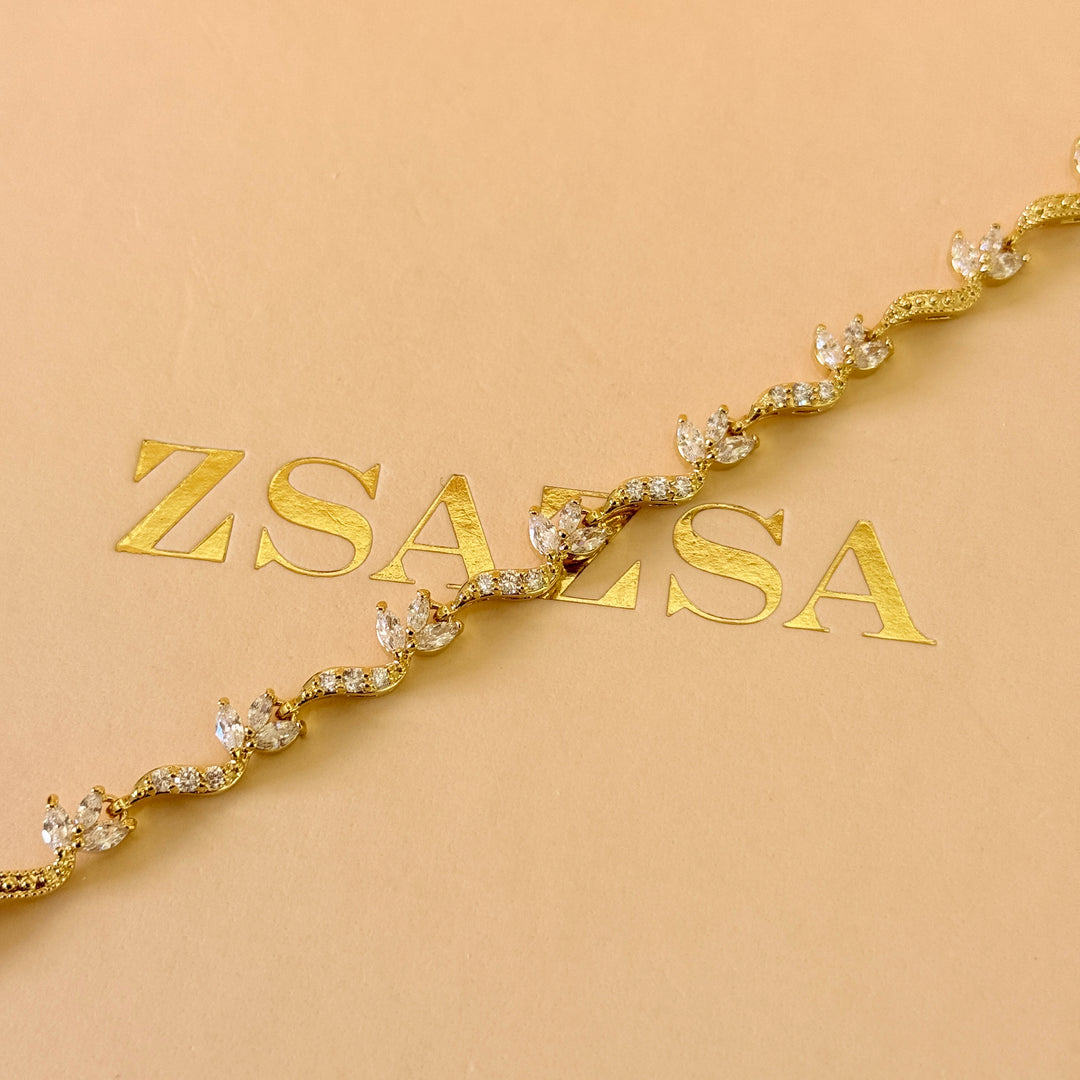 Teardrop and marquise zircone gold plated earrings and bracelet