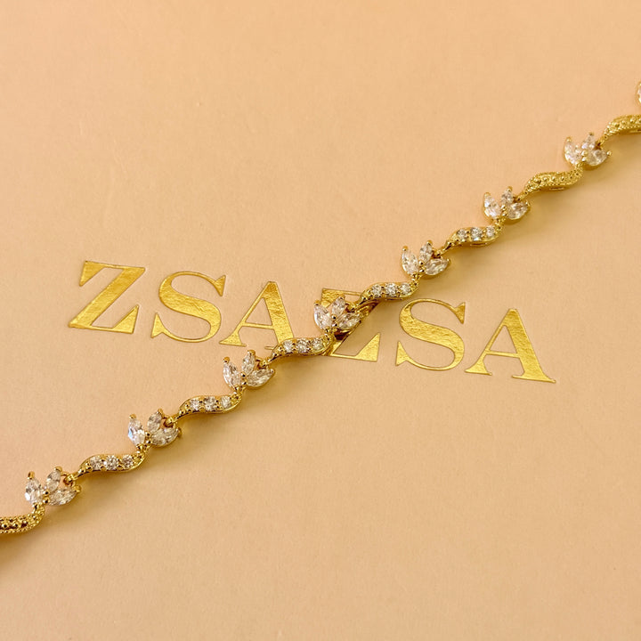 Teardrop and marquise zircone gold plated earrings and bracelet