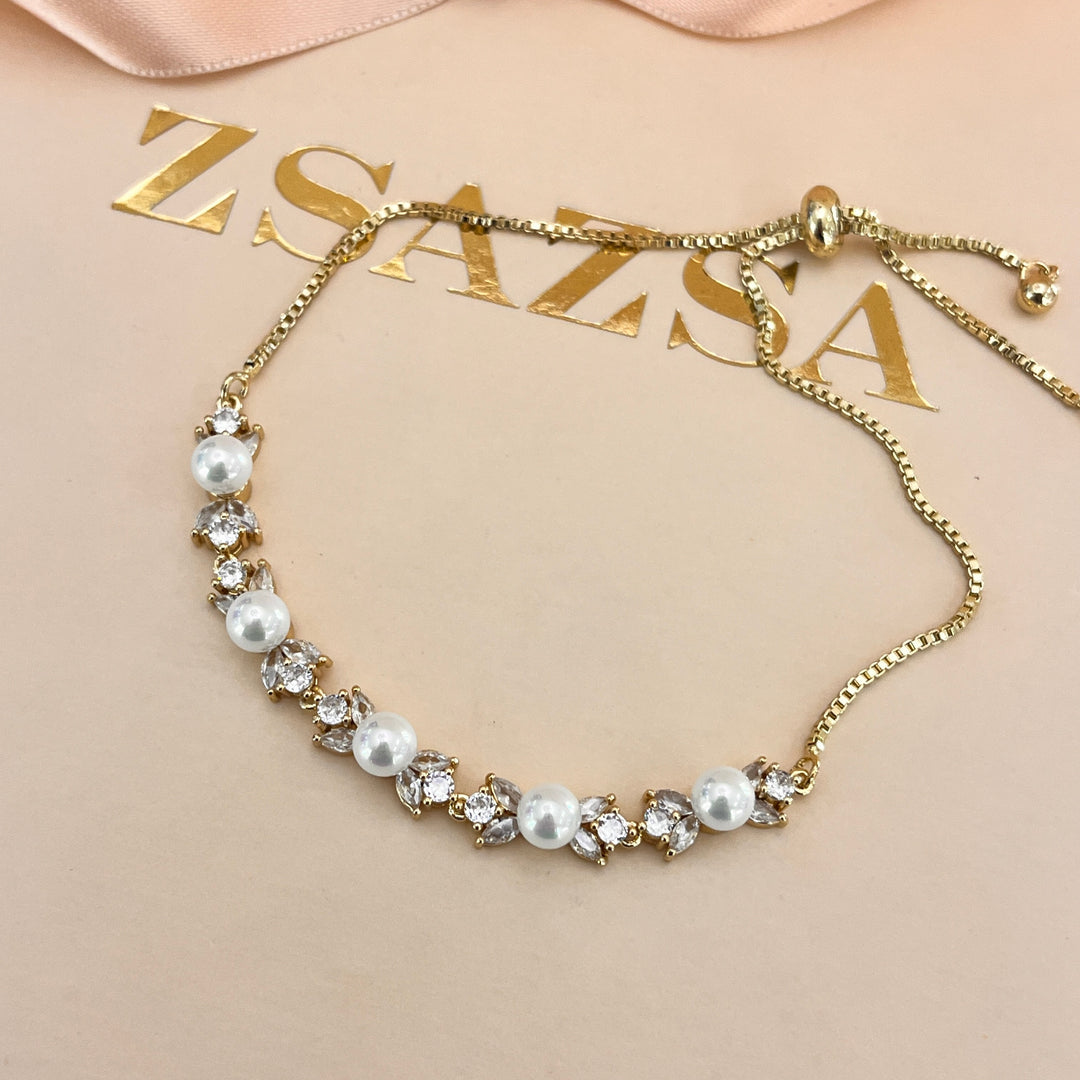 Zircone and white pearls gold plated bracelet