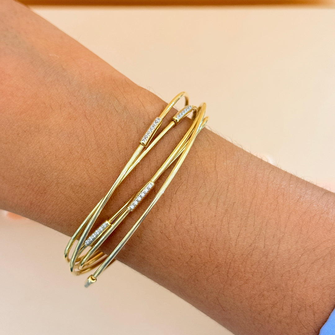 Zircone crossed gold plated sterling silver bangle