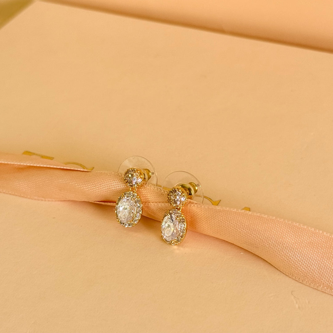 Round and oval dangle zircone gold plated earrings