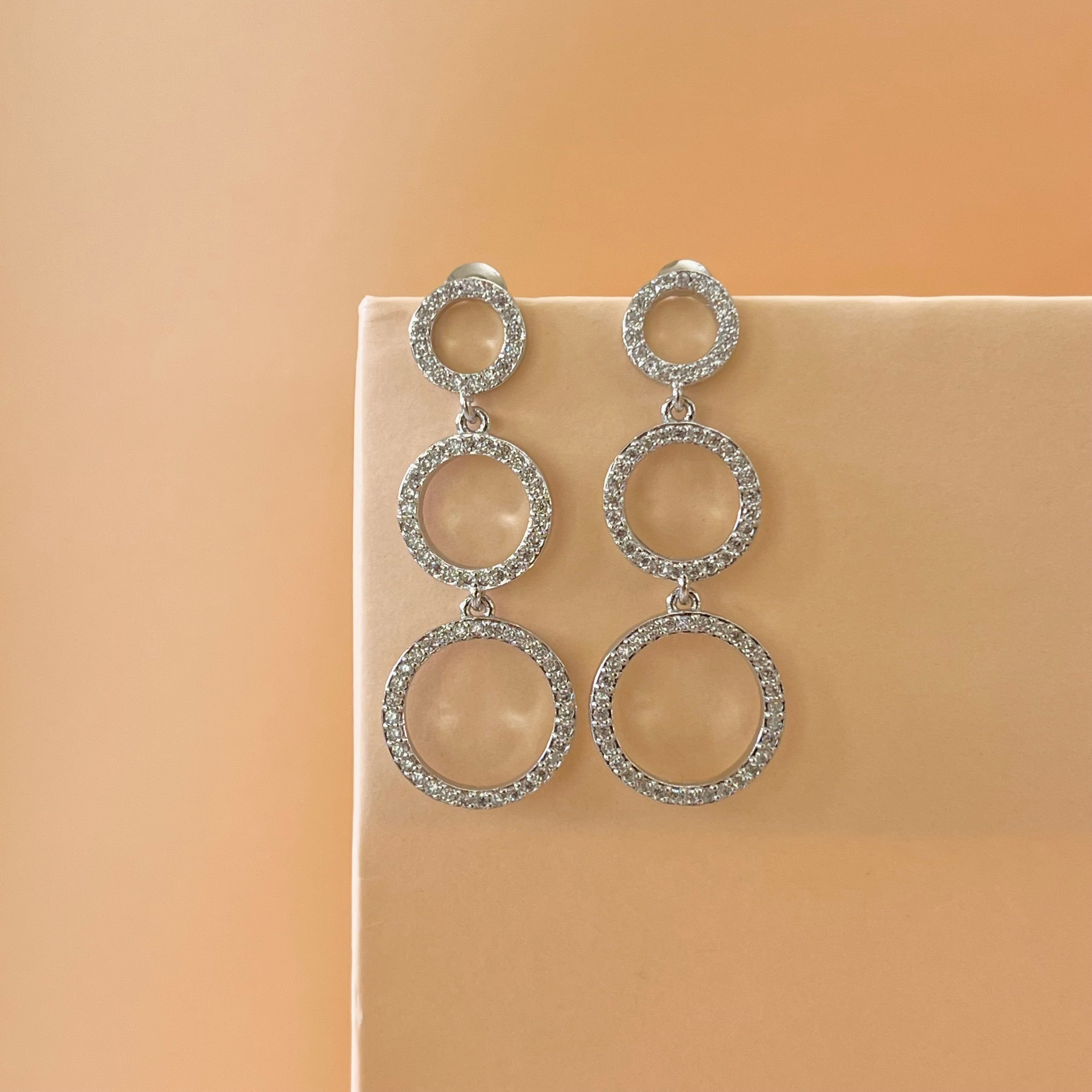 Silver zircone triple round earrings