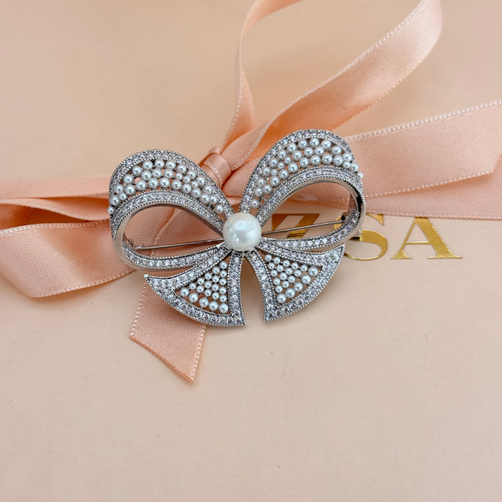 Bow pearl and zircone silver brooch