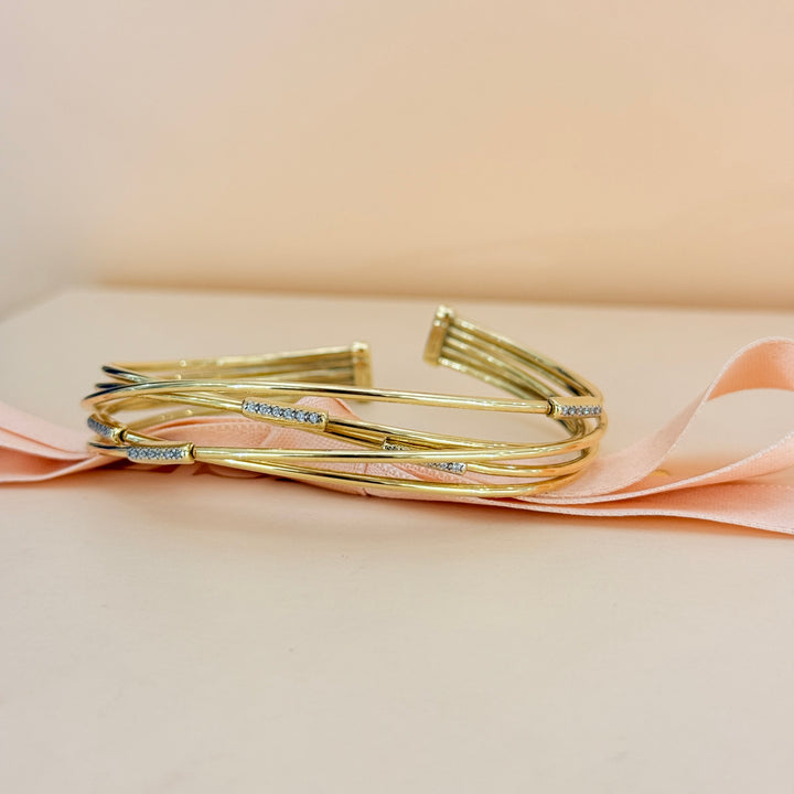 Zircone crossed gold plated sterling silver bangle
