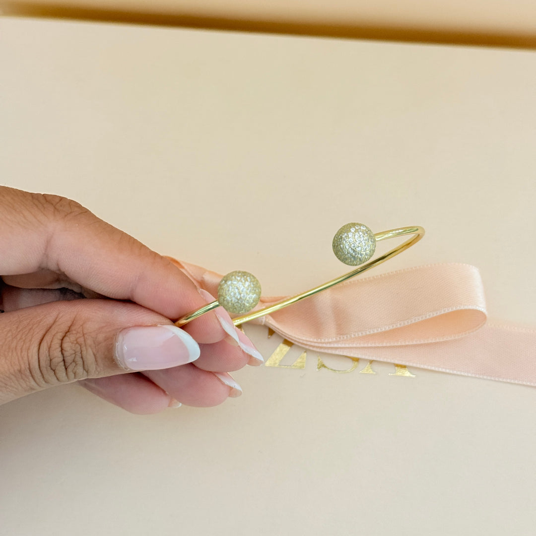 Zircone half ball gold plated bangle