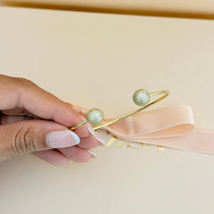 Zircone half ball gold plated bangle