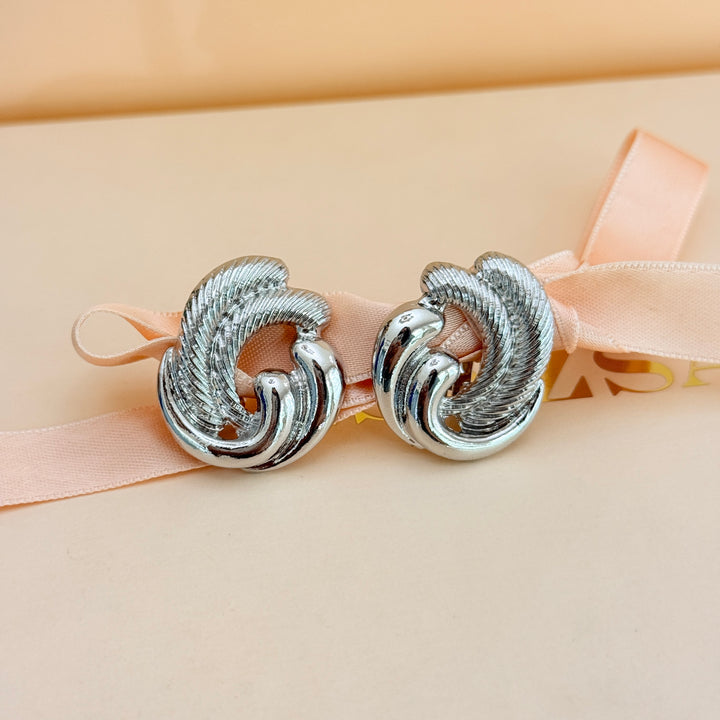 Plain twisted silver clip on earrings