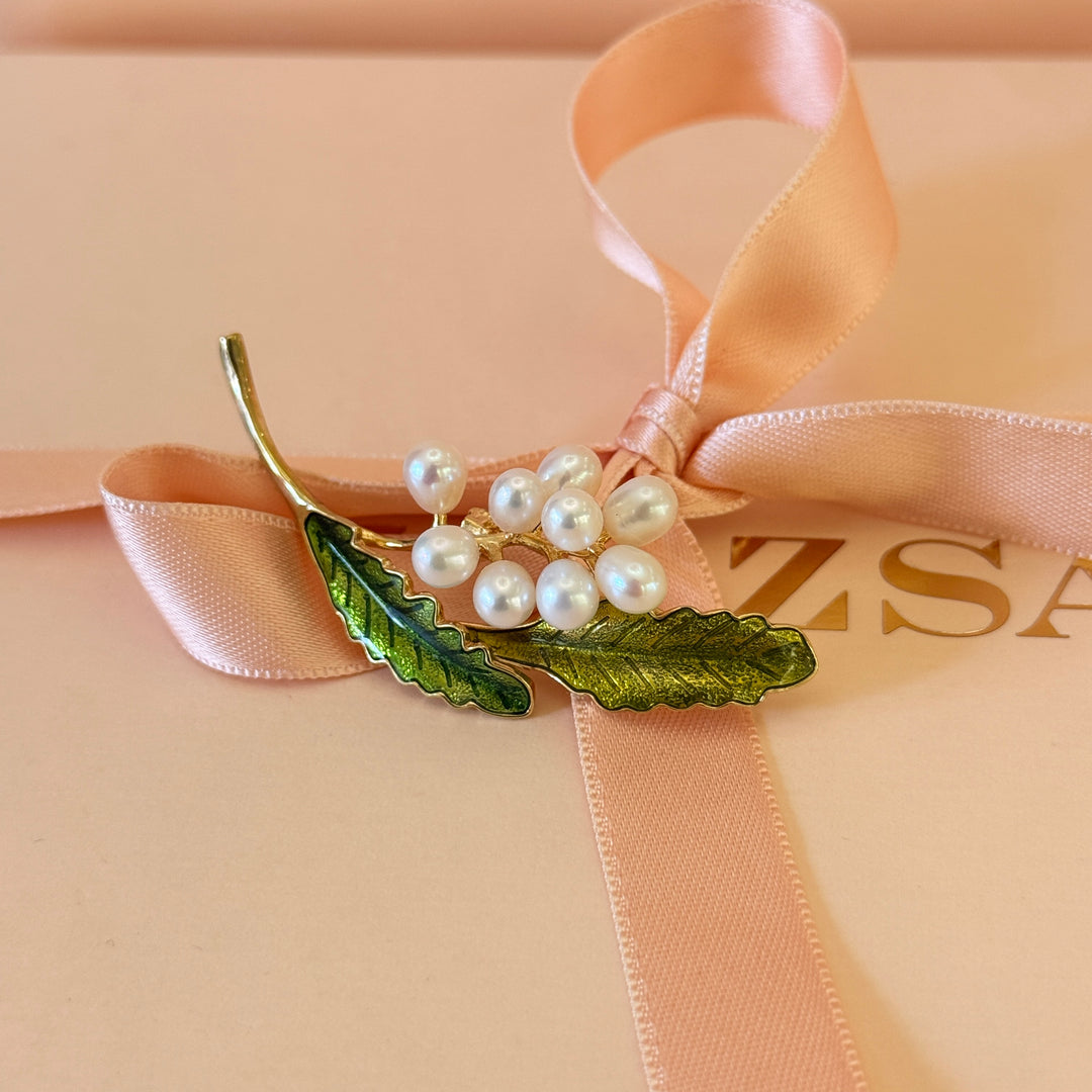Pearls and green leaves gold plated brooch