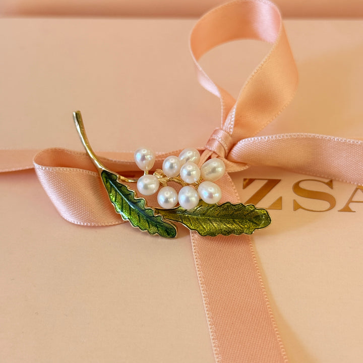 Pearls and green leaves gold plated brooch