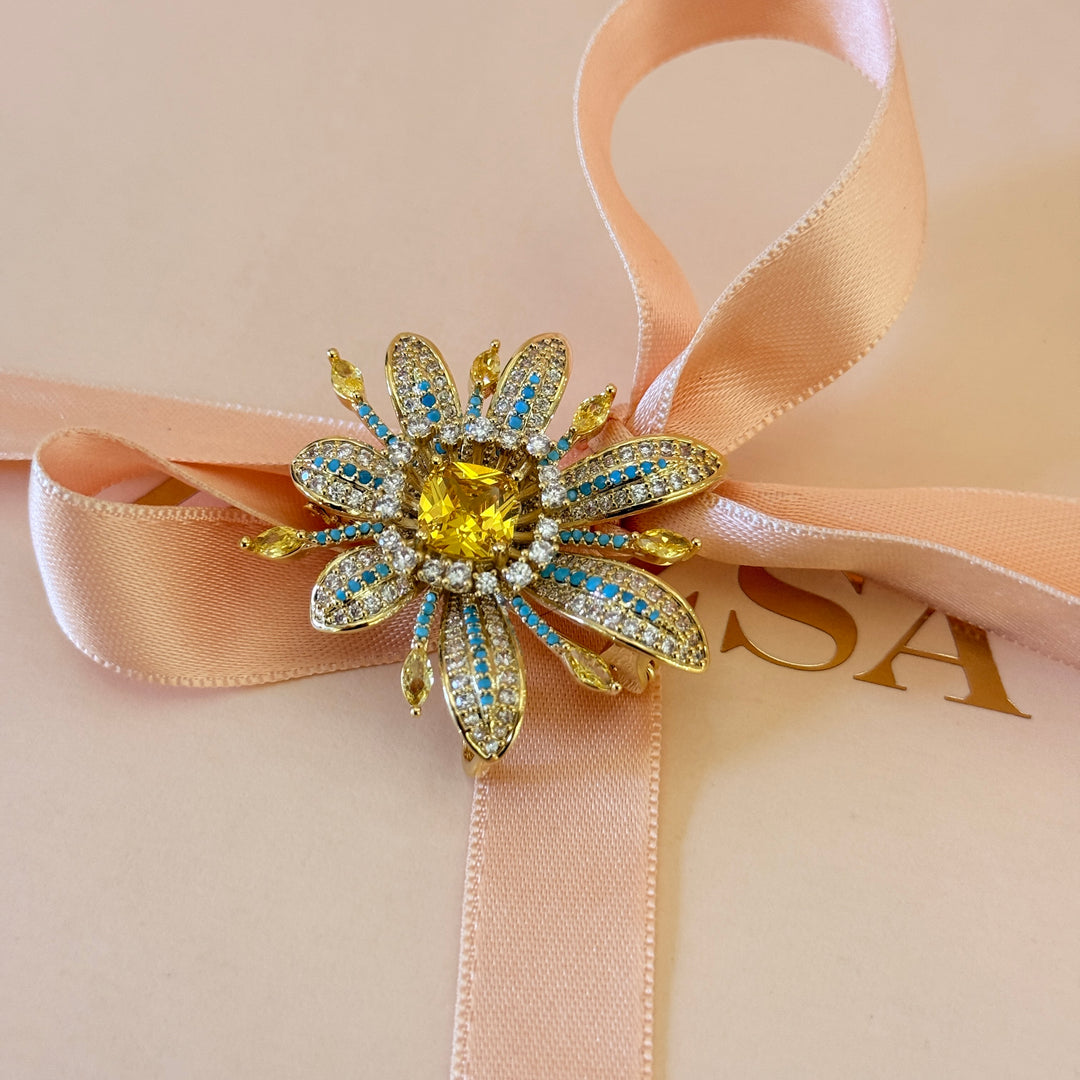 Yellow and turquoise zircone gold plated brooch