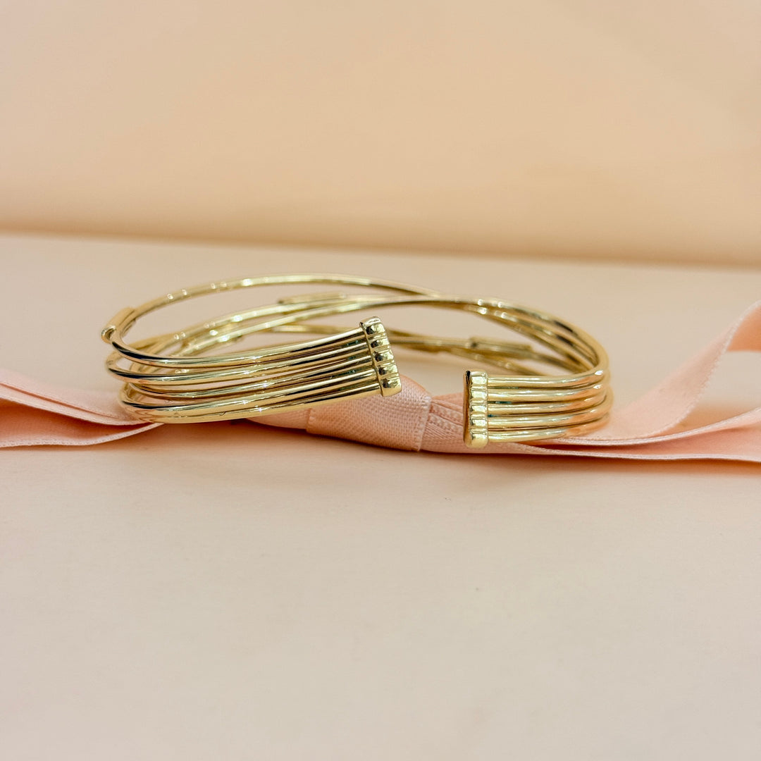 Zircone crossed gold plated sterling silver bangle