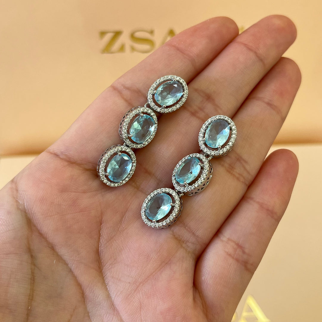 Turquoise oval zircone set