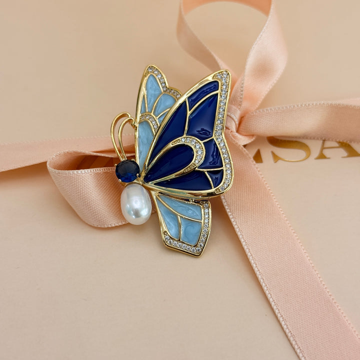 Blue enamel and zircone pearl gold plated brooch