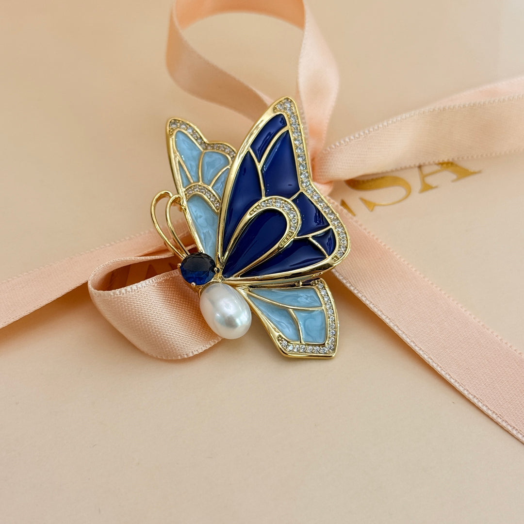 Blue enamel and zircone pearl gold plated brooch