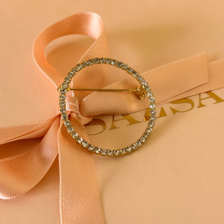 Round rhinestone gold plated brooch