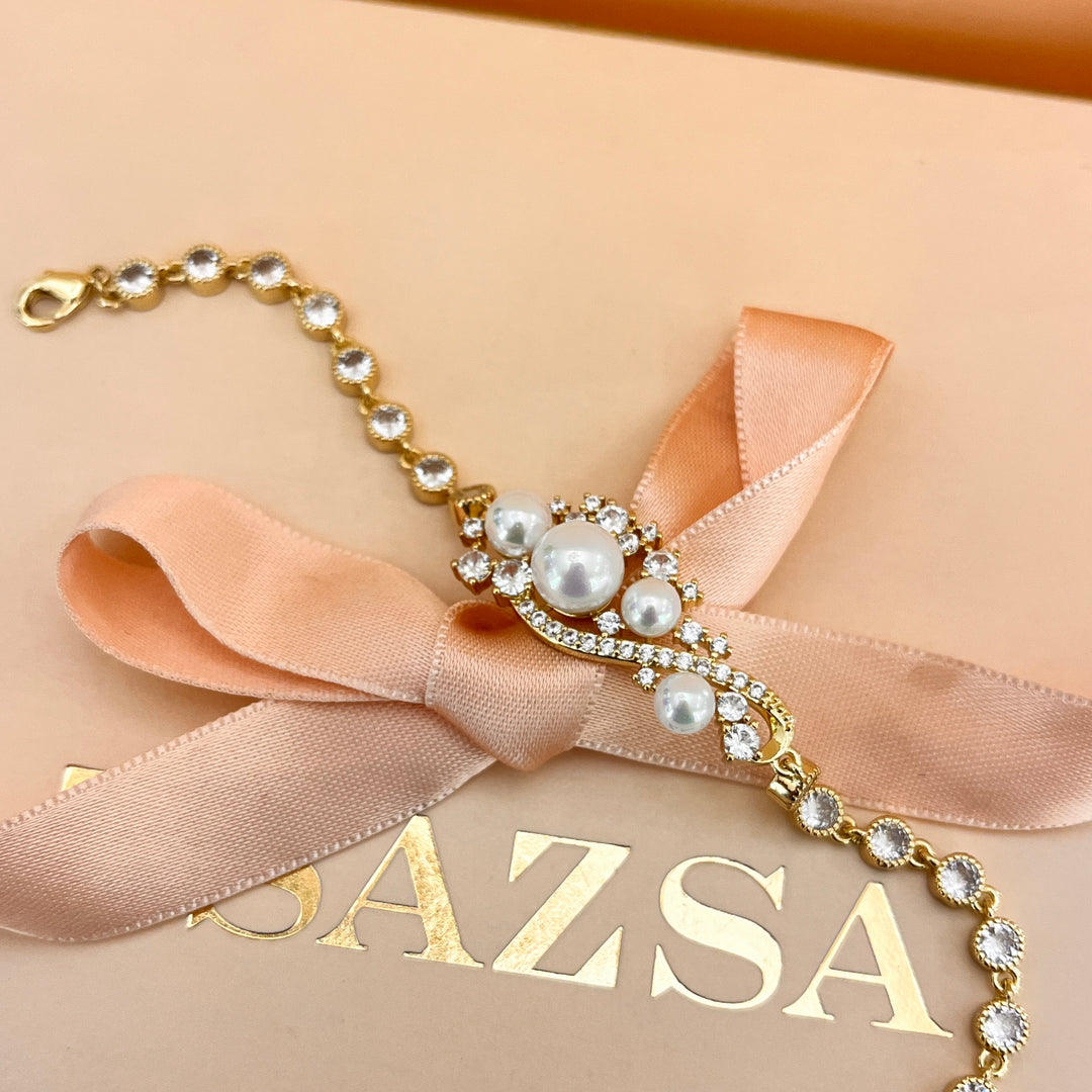Zircone and white pearls gold plated bracelet