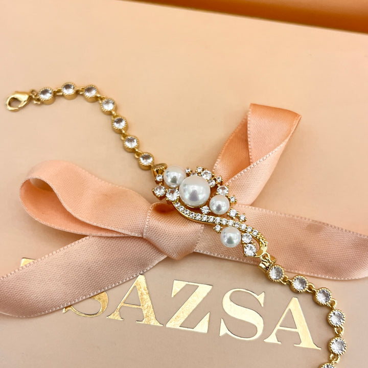 Zircone and white pearls gold plated bracelet