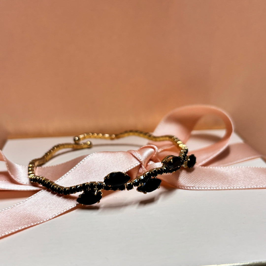 Dainty black gold bangle