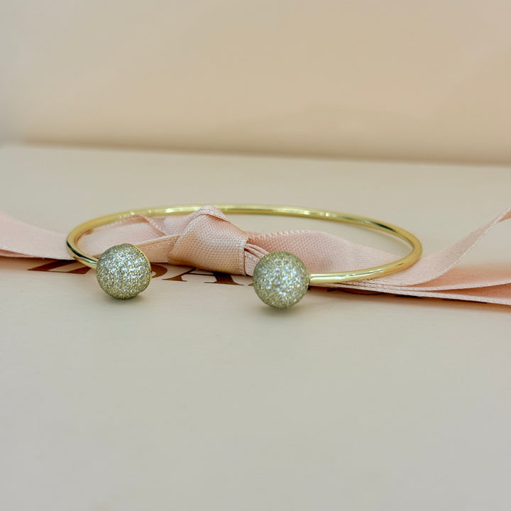 Zircone half ball gold plated bangle