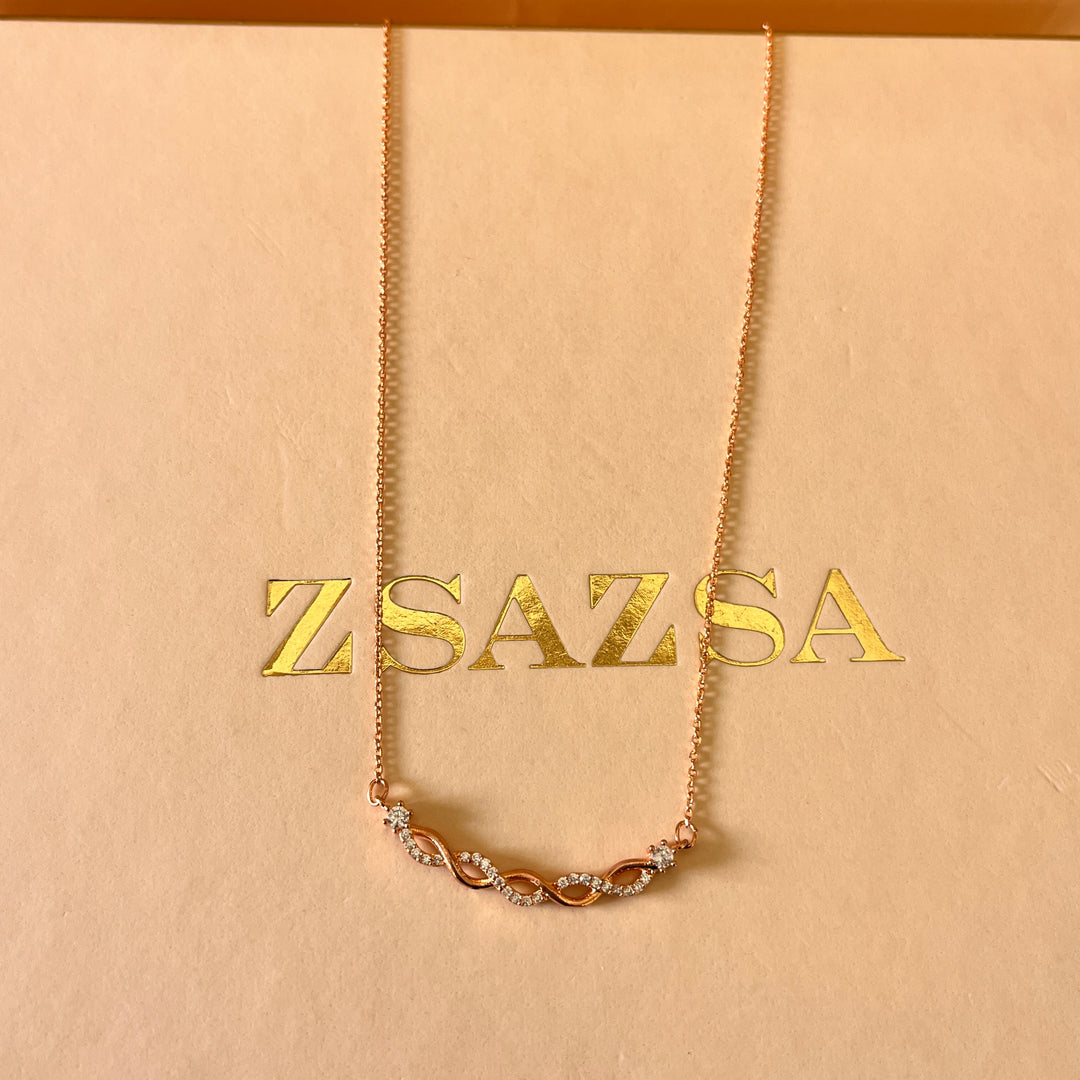 zircone rose gold plated twisted pendant