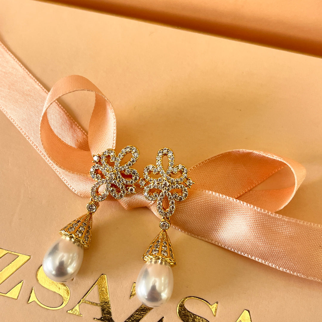 Zircone and pearls gold plated earrings